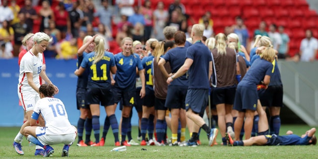 U.S.'s Megan Rapinoe and Carli Lloyd after a penalty shoot-out by Sweeden on Aug. 12, 2016.