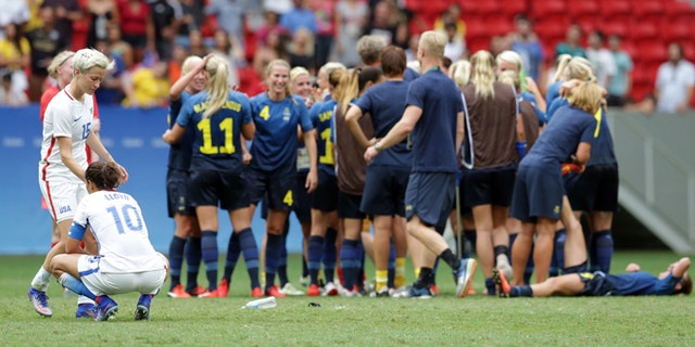 U.S.'s Megan Rapinoe and Carli Lloyd after a penalty shoot-out by Sweeden on Aug. 12, 2016.