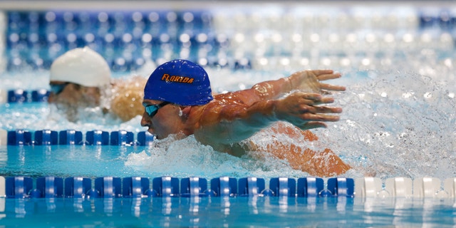 June 25, 2012: Ryan Lochte, right, and Michael Phelps compete in the men's 400-meter individual medley final at the U.S. Olympic swimming trials in Omaha, Neb.