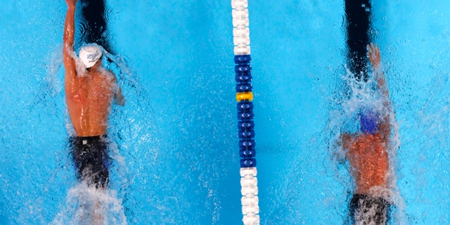 June 27, 2012: Michael Phelps, left, and Ryan Lochte compete in the men's 200-meter freestyle final at the U.S. Olympic swimming trials, in Omaha, Neb.