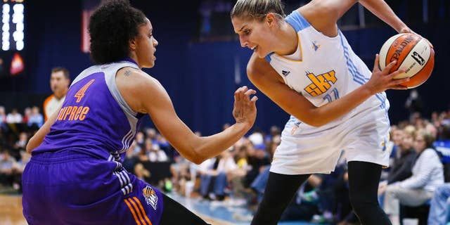 FILE- In this Sept. 12, 2014, file photo, Chicago Sky forward Elena Delle Donne (11) works the ball against Phoenix Mercury forward Candice Dupree (4) during the second half of Game 3 of the WNBA Finals basketball series in Chicago. Delle Donne became the latest post player to withdraw from the U.S. women's basketball team because of injury. (AP Photo/Kamil Krzaczynski, File)