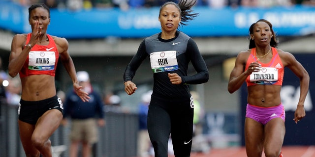 June 28, 2012: Allyson Felix finishes her heat in the women's 200 meters at the U.S. Olympic Track and Field Trials in Eugene, Ore ahead of Joanna Atkins, left, and Tiffany Townsend.