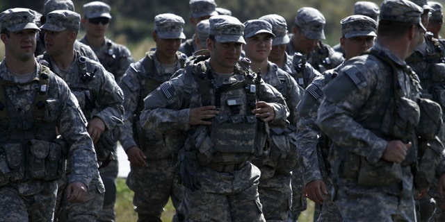 In this Sept. 19, 2014 photo, U.S. servicemen take part in military exercises outside the town of Yavoriv near Lviv, in Ukraine.