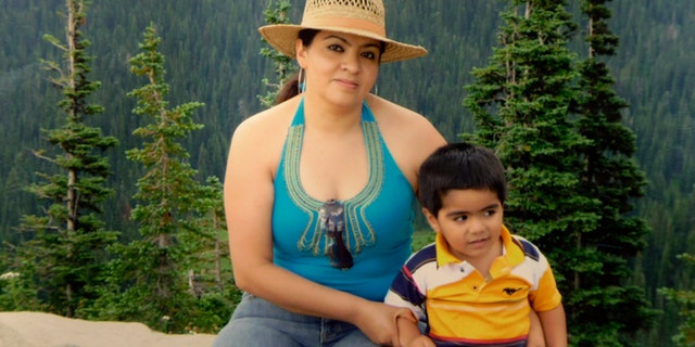 This 2009 family photo provided by Grisel Rodriguez shows Nestora Salgado, who has been detained since she was arrested Aug. 21, 2013 in the state of Guerrero, south of Mexico City, where she had been leading a vigilante group targeting police corruption and drug cartel violence. At right is her grandson, Cristian Rodriguez, who she was raising at the time the photo was taken. (AP Photo/Courtesy Grisel Rodriguez)