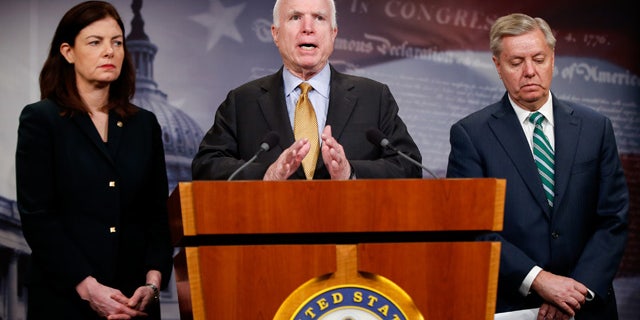 March 26, 2015: Senate Armed Service Committee Chairman Sen. John McCain, R-Ariz., center, accompanied by fellow committee members, Sen. Kelly Ayotte, R-N.H., left, and Sen. Lindsey Graham, R-S.C., speaks during a news conference on Capitol Hill in Washington to talk about the situation in Yemen. (AP Photo/Andrew Harnik)