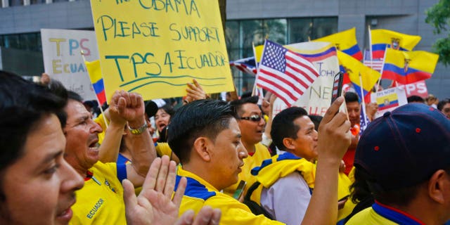 A coalition of community leaders and immigrant advocates demonstrate outside U.S. immigration offices, calling on federal authorities to designate Ecuador for Temporary Protected Status (TPS) for its nationals in the aftermath of last April's 7.8 magnitude earthquake, Wednesday June 1, 2016, in New York. (AP Photo/Bebeto Matthews)