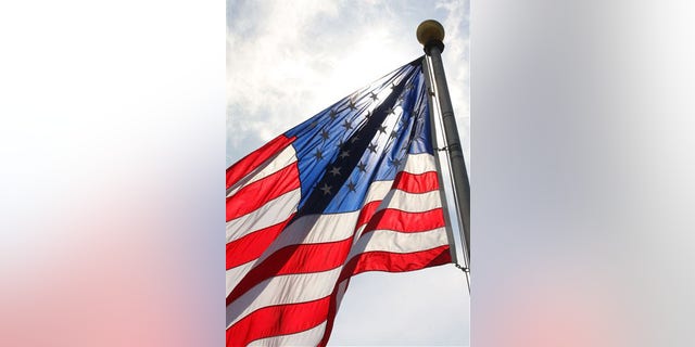 A flag flies in the breeze at the U.S. Flag Plaza at Liberty State Park in Jersey City, N.J. on Monday. June 13, 2011. Flag Day is Tuesday, June 14. (AP Photo/The Jersey Journal, Pamela Suchy)