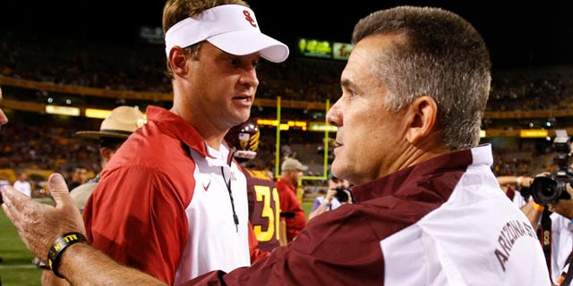 Sept. 28, 2013: Southern California head coach Lane Kiffin shakes hands with Arizona State head coach Todd Graham after an NCAA college football game in Tempe, Ariz.