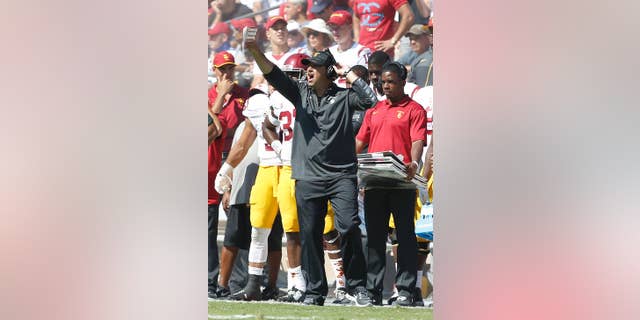 Southern California head coach Steve Sarkisian argues a referees call during the second half against Stanford in a NCAA college football game on Saturday, Sept. 6, 2014, in Stanford, Calif. Southern California won 13-10. (AP Photo/Tony Avelar)
