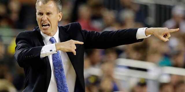 Mar. 30, 2013: Florida Gulf Coast head coach Andy Enfield reacts to action against Florida during the second half of a regional semifinal game in the NCAA college basketball tournament.