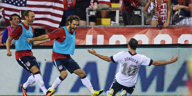 COLUMBUS, OH - SEPTEMBER 10:  Landon Donovan #10 of the United States Men's National Team celebrates his second half goal against Mexico with teammates Brad Davis #17 of the United States MenÃs National Team, far left, and Graham Zusi #19 of the United States MenÃs National Team, middle, at Columbus Crew Stadium on September 10, 2013 in Columbus, Ohio. The United States defeated Mexico 2-0.  (Photo by Jamie Sabau/Getty Images)