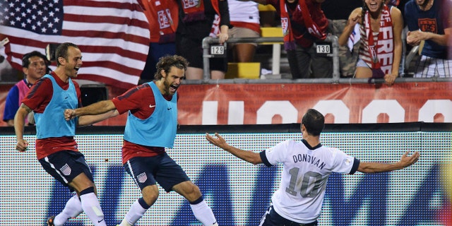 COLUMBUS, OH - SEPTEMBER 10: Landon Donovan #10 of the United States Men's National Team celebrates his second half goal against Mexico with teammates Brad Davis #17 of the United States MenÃs National Team, far left, and Graham Zusi #19 of the United States MenÃs National Team, middle, at Columbus Crew Stadium on September 10, 2013 in Columbus, Ohio. The United States defeated Mexico 2-0. (Photo by Jamie Sabau/Getty Images)