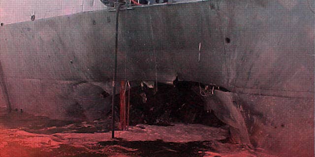 Damage to USS Cole destroyer at port of Aden, Yemen, (AP)