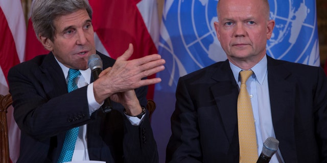 Feb. 25, 2014: British Foreign Secretary William Hague listens at right as Secretary of State John Kerry speaks at the State Department in Washington.