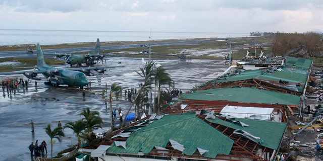 FILE: Nov. 9, 2013: Philippine military C130 cargo planes ferrys supplies park at the tarmac outside an airport after super Typhoon Haiyan battered Tacloban city in central Philippines.