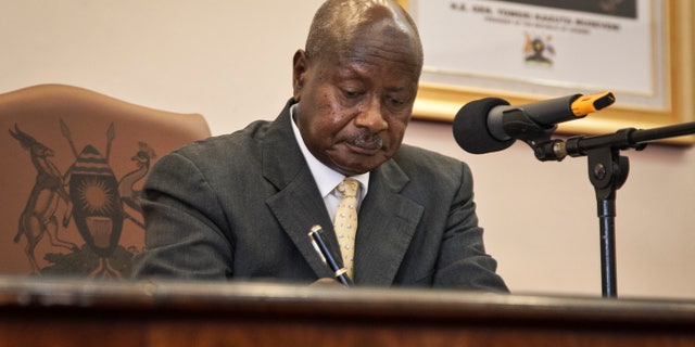 Feb. 24, 2014 - Uganda's President Yoweri Museveni signs a new anti-gay bill that sets harsh penalties for homosexual sex, in Entebbe, Uganda. Museveni signed the controversial bill into law, with penalties including 14 years in jail for first-time offenders and life imprisonment as the maximum penalty for "aggravated homosexuality," saying it is needed to deter what he called the West's social imperialism," promoting homosexuality in Africa.