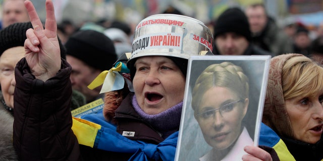 Feb. 9, 2014 - FILE photo of opposition supporter holding a portrait of former prime minister Yulia Tymoshenko during a rally in Independence Square in Kiev, Ukraine.