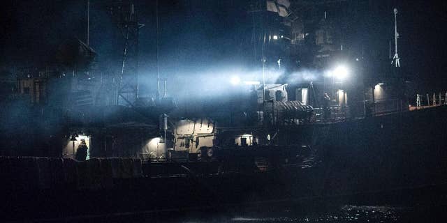 Ukrainian navy corvette Ternopil is anchored at Ukrainian navy base in Sevastopol, Ukraine, early Tuesday, March 4, 2014. Russian troops said to be 16,000 strong tightened their stranglehold on Ukraine's Crimean Peninsula Monday, openly defying the U.S. and the European Union and rattling world capitals and stock markets. (AP Photo/Andrew Lubimov)