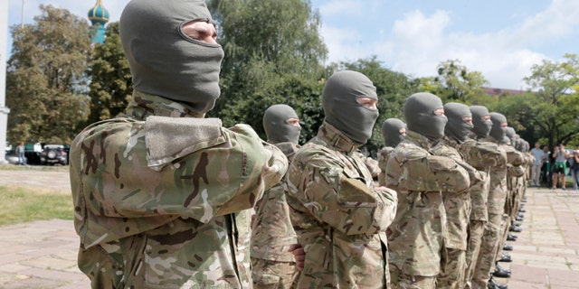 August 17, 2014: Volunteers take an oath of allegiance to Ukraine, before being sent to the eastern part of Ukraine to join the ranks of special battalion 'Azov' fighting against pro-Russian separatists. (AP Photo/Efrem Lukatsky)