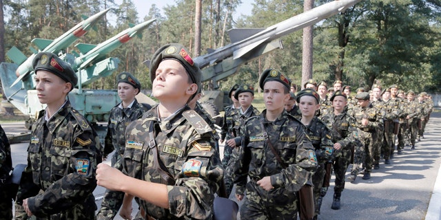 September 9, 2014: Students march during a military training exercise in a military school in Boyarka, near Kiev, Ukraine. (AP Photo/Efrem Lukatsky)