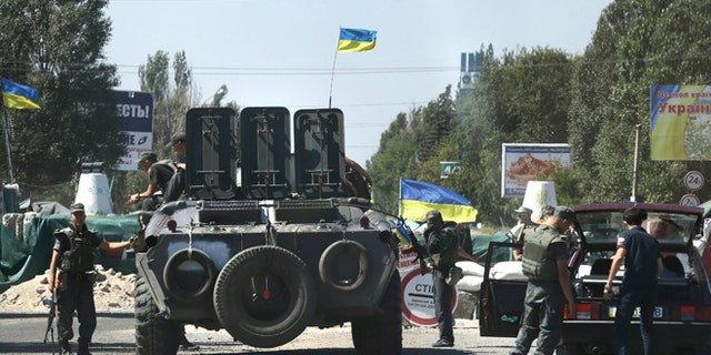 Aug. 27, 2014: Ukrainian soldiers at a checkpoint in the town of Mariupol, eastern Ukraine.