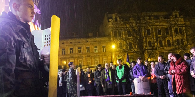 FILE: February 21, 2014: A funeral for an anti-government protester who was killed during clashes with riot police, in Lviv, Ukraine.