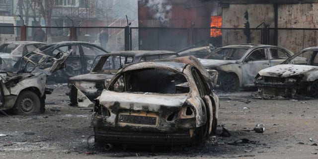 Jan. 24, 2015: Burned cars on a destroyed parking site in a residential area in Mariupol, Ukraine.