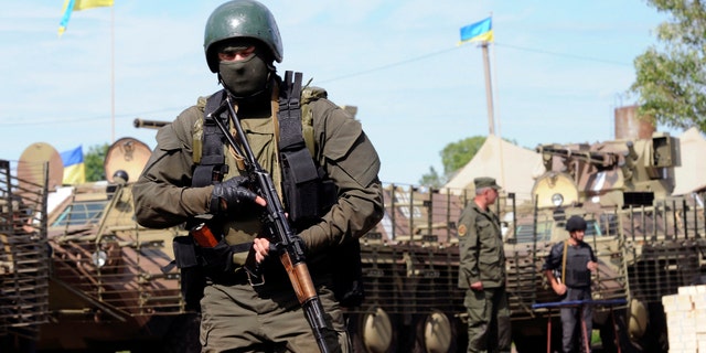 Ukrainian servicemen are pictured at the military camp near the town of Svyatogorsk in Eastern Ukraine, June 20, 2014.