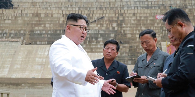 The slogan in the background reads: "March toward the final victory!”