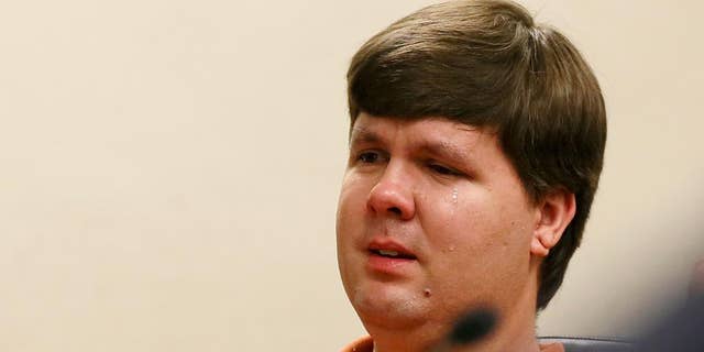 FILE -  In a Thursday, July 3, 2014, file photo, Justin Ross Harris, the father of a toddler who died after police say he was left in a hot car for about seven hours, weeps as he sits at his bond hearing in Cobb County Magistrate Court, in Marietta, Ga. 