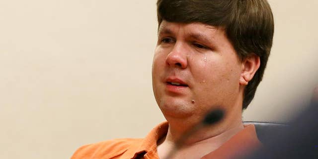 FILE - In a Thursday, July 3, 2014, file photo, Justin Ross Harris, the father of a toddler who died after police say he was left in a hot car for about seven hours, weeps as he sits at his bond hearing in Cobb County Magistrate Court, in Marietta, Ga.