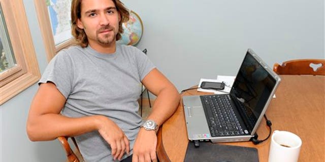 September 2: Ryan McGrath, 26, poses in his home in Michigan City, Ind. McGrath has been working part time designing web sites for small businesses but wants steadier full-time work.
