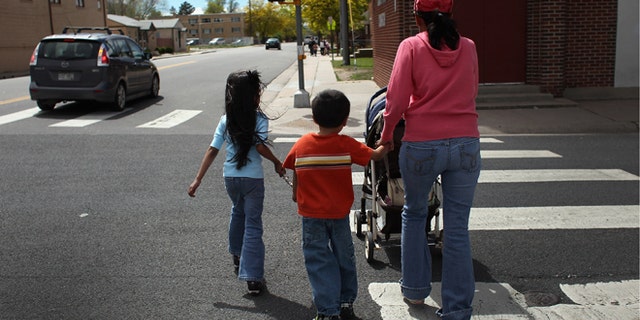 AURORA, CO - MAY 21: Undocumented Mexican immigrant Jeanette Vizguerra walks home with her three American-born children on May 21, 2011 in Aurora, Colorado. Vizguerra is facing deportation to Mexico and is scheduled for a final hearing July 13 at Denver's Federal Courthouse. Just one of millions of undocumented immigrants living in the United States, Vizguerra first came to Colorado from Mexico City with her husband 14 years before. She is a small business owner of a janitorial service and a community organizer for immigration rights. Stopped two years ago by a traffic policemen for driving with expired tags, Vizguerra was taken to jail when she could not prove she was in the country legally. Out on bail during lengthy court proceedings, she now faces the real possibility that she will be deported back to Mexico and separated from her family in the United States. (Photo by John Moore/Getty Images)