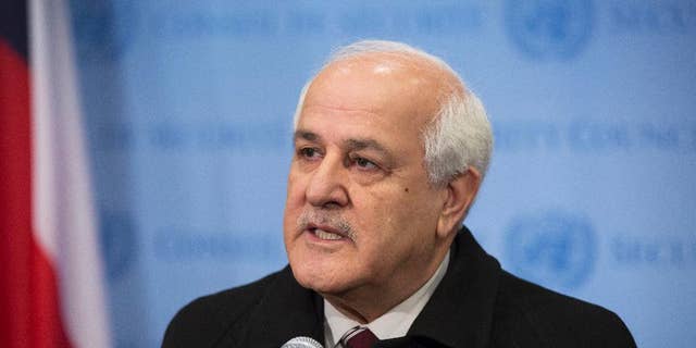 In this photo provided by the United Nations, Palestinian Ambassador to the U.N. Riyad Mansour addresses the media at U.N. headquarters after submitting documents to join the International Criminal Court on Friday, Jan. 2, 2015. The Palestinians moved quickly to join the court after suffering a defeat in the U.N. Security Council, which rejected a resolution Tuesday that would have set a three-year deadline for the establishment of a Palestinian state on lands occupied by Israel. (AP Photo/UN Photo, Evan Schneider)