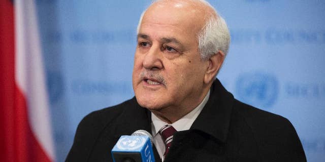 In this photo provided by the United Nations, Palestinian Ambassador to the U.N. Riyad Mansour addresses the media at U.N. headquarters after submitting documents to join the International Criminal Court on Friday, Jan. 2, 2015. The Palestinians moved quickly to join the court after suffering a defeat in the U.N. Security Council, which rejected a resolution Tuesday that would have set a three-year deadline for the establishment of a Palestinian state on lands occupied by Israel. (AP Photo/UN Photo, Evan Schneider)