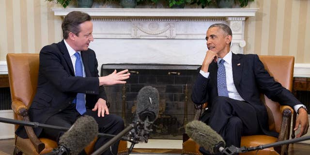 FILE - In this Jan. 16, 2015 file photo, President Barack Obama meets with British Prime Minister David Cameron, in the Oval Office of the White House in Washington. U.S. Sen. Lindsey Graham, a leading Republican critic of Obama's foreign policy, is pushing new sanctions against Iran over its nuclear program, unswayed by a White House veto threat and lobbying by Britain's leader.  (AP Photo/Carolyn Kaster, File)