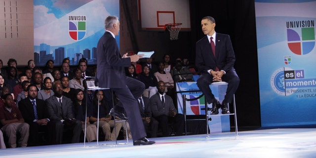 WASHINGTON - MARCH 28:  U.S. President Barack Obama (R) and moderator Jorge Ramos participate in an education town hall hosted by Univision at Bell Multicultural High School, Washington, DC. Obama is set to speak to the nation in the evening about the U.S. role in Libya.   (Photo by Dennis Brack-Pool/Getty Images)