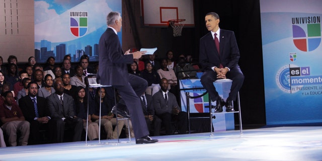 WASHINGTON - MARCH 28: U.S. President Barack Obama (R) and moderator Jorge Ramos participate in an education town hall hosted by Univision at Bell Multicultural High School, Washington, DC. Obama is set to speak to the nation in the evening about the U.S. role in Libya. (Photo by Dennis Brack-Pool/Getty Images)