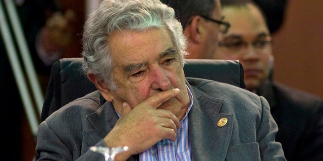 FILE - In this Dec. 3, 2011 file photo, Uruguay's President Jose Mujica attends a working session of the Community of Latin American and Caribbean States, CELAC, summit in Caracas, Venezuela. Uruguay's president has canceled his trip Thursday, Nov. 15, 2012, to the Ibero-American Summit in Spain, saying doctors have ordered bed rest after a painful blood clot was found in his lower right leg. The 77-year-old Jose Mujica says the clot was found with a sonogram and that he's following doctors' orders to relax at home for two or three days while taking anti-coagulant medicine. (AP Photo/Ariana Cubillos, File)