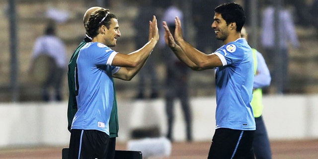 AMMAN, JORDAN- NOVEMBER 13: Diego Forlan of Uruguay replaces Luis Suarez during the FIFA 2014 World Cup Qualifier: Intercontinental Play-off First Leg between Jordan and Uruguay on November 13, 2013 in Amman, Jordan. (Photo by Salah Malkawi/ Getty Images)