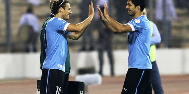AMMAN, JORDAN- NOVEMBER 13: Diego Forlan of Uruguay replaces Luis Suarez during the FIFA 2014 World Cup Qualifier: Intercontinental Play-off First Leg between Jordan and Uruguay on November 13, 2013 in Amman, Jordan. (Photo by Salah Malkawi/ Getty Images)