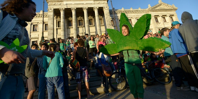 Dec. 10, 2013: People attend a demonstration in support of the legalization of marijuana outside the Congress in Montevideo, Uruguay.
