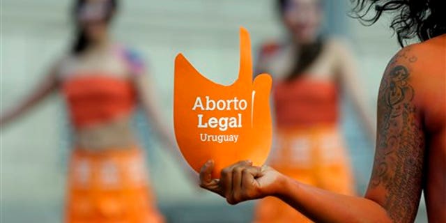Pro-abortion activists demonstrate in front of the Uruguayan Congress in Montevideo, Uruguay.