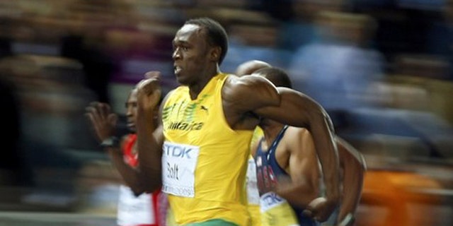Usain Bolt of Jamaica sprints to the finish to win in the men's 100 meters final during the world athletics championships at the Olympic stadium in Berlin.