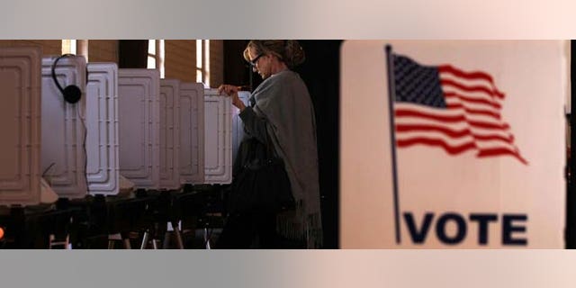 SANDY SPRINGS, GA - MARCH 06: Local resident Teri Rogers casts her vote at a polling station in St Andrew Presbyterian Church March 6, 2012 in Sandy Springs, Georgia. Ten states, including Georgia, hold caucuses and primaries today for voters to pick their choices for the Republican presidential nominee. (Photo by Alex Wong/Getty Images)