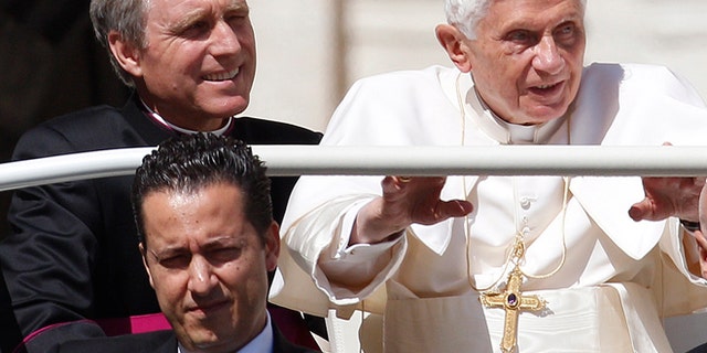 FILE 2012: Pope Benedict XVI, his then-butler Paolo Gabriele, bottom, and his personal secretary Georg Gaenswein sit in the car with him.