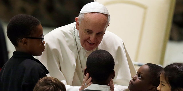 Pope Francis meets children at the Vatican, Saturday, Dec. 14, 2013.