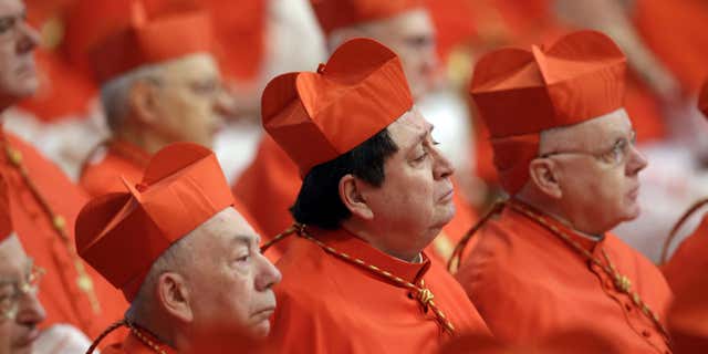Feb. 14, 2015: Cardinals listens to Pope Francis celebrating a Mass in St. Peter's Basilica at the Vatican.