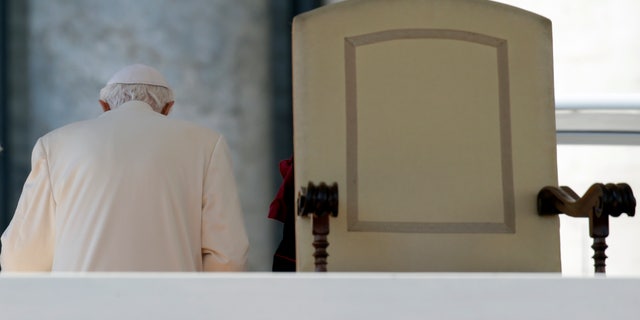 Feb. 27, 2013 FILE photo shows Pope Benedict XVI leaving after celebrating his last general audience, in St. Peter's Square, at the Vatican.