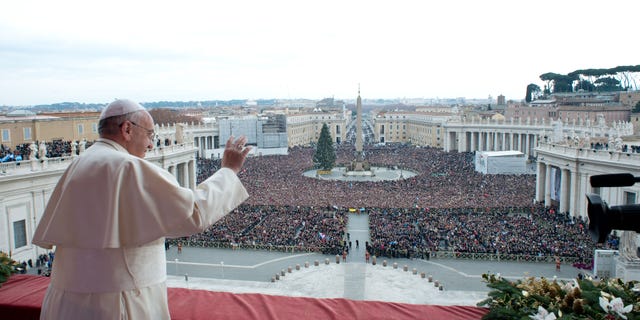 Dec. 25, 2013: In this picture provided by the Vatican newspaper L'Osservatore Romano, Pope Francis delivers his "Urbi et Orbi" (to the City and to the World) message from the central balcony of St. Peter's Basilica at the Vatican.
